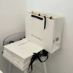 Custom Logo Luxury Style Kraft Paperboard Gift Bags Versatile Packaging For Small Business Clothing Food Retail Ribbon
