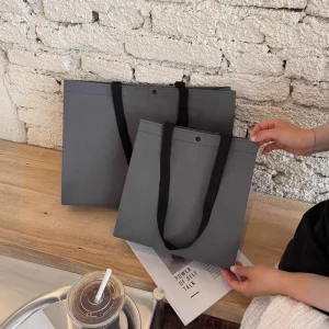 Fashionable Luxury Grey Nonwoven Fabric Bag Boutique Reusable Shopping Tote Bag with Custom Logo and Button Closure