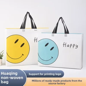 In-stock Non-woven Smiling Face logo Screen Printed Laminated Three-dimensional Tote Bags Advertising Clothing Shopping Gift