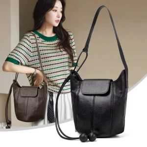Luxury Rounded Genuine Leather Bucket Bag with Drawstring and Ball Pendant for Women Elegant Shoulder Crossbody Bag for Travel