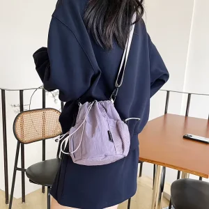 The lady’s crossbody bag is made of nylon lightweight water-resistant foldable and has a drawstring closure for a large capacity